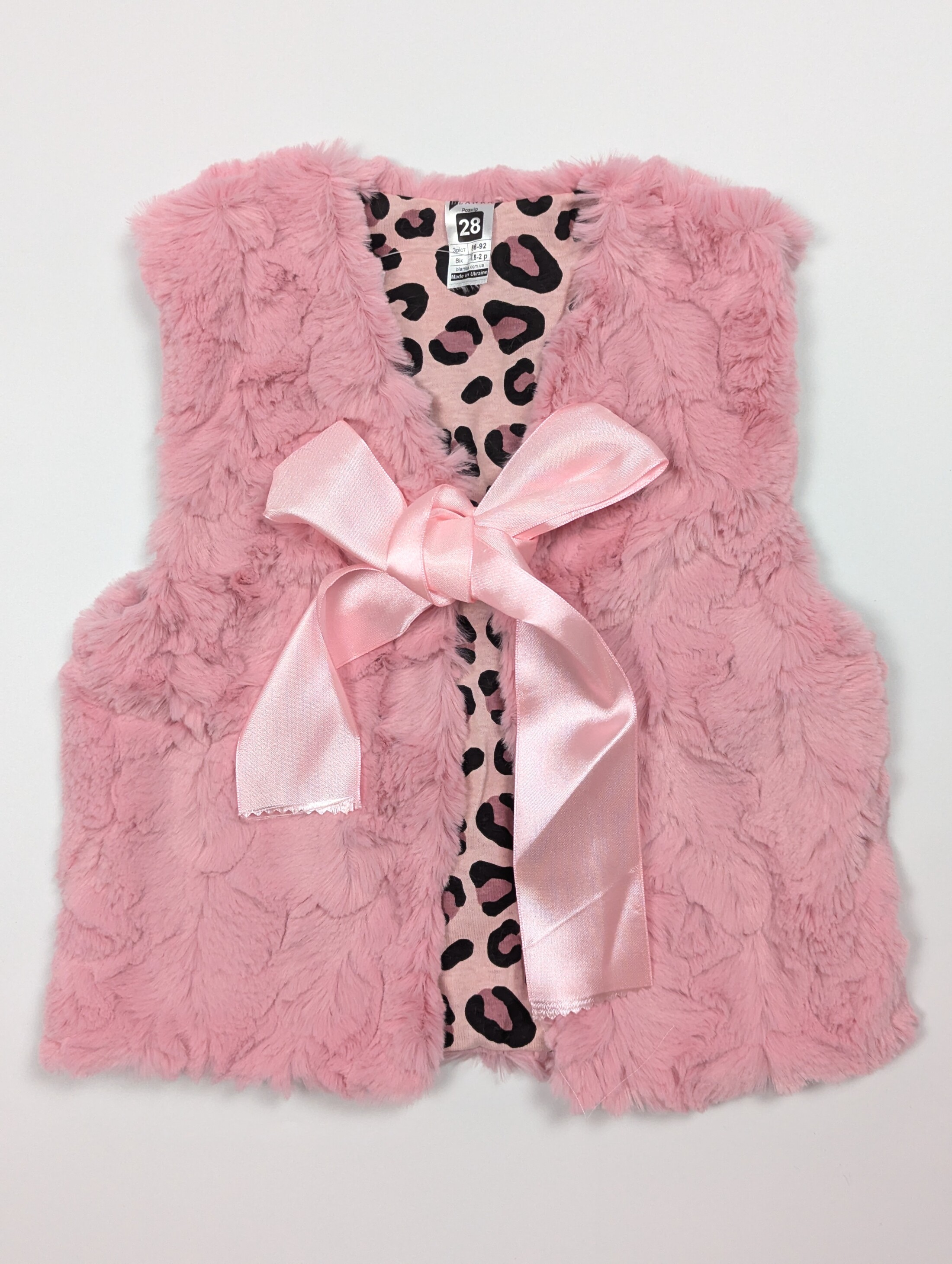 Рожевий жилет для дівчинки жаккард махра з бантиком